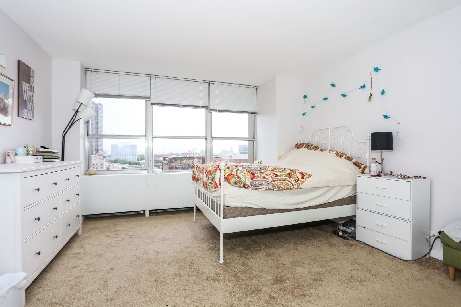 655 West Irving Park Road, Unit 1017 Chicago, IL 60613 - Photo 14 of 24 a bedroom with bed and window