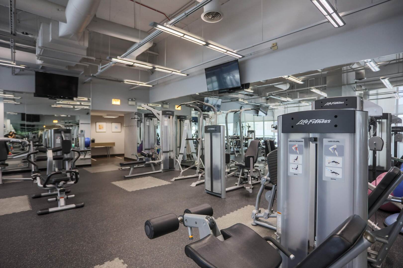 655 West Irving Park Road, Unit 1017 Chicago, IL 60613 - Photo 16 of 24 a view of a room with gym equipment