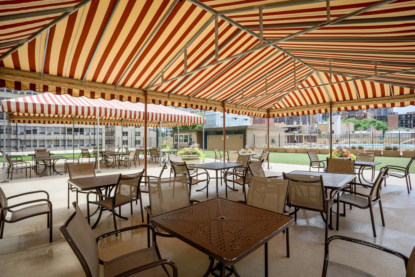 655 West Irving Park Road, Unit 1017 Chicago, IL 60613 - Photo 19 of 24 a view of a patio with a table and chairs