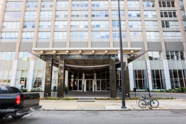 a view of a brick building and a large window