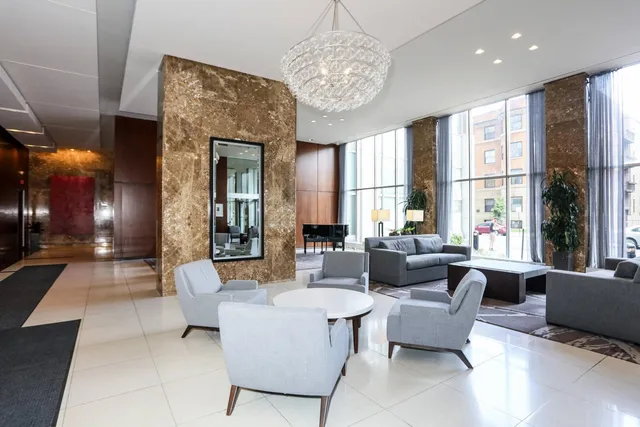 a living room with furniture and a large window