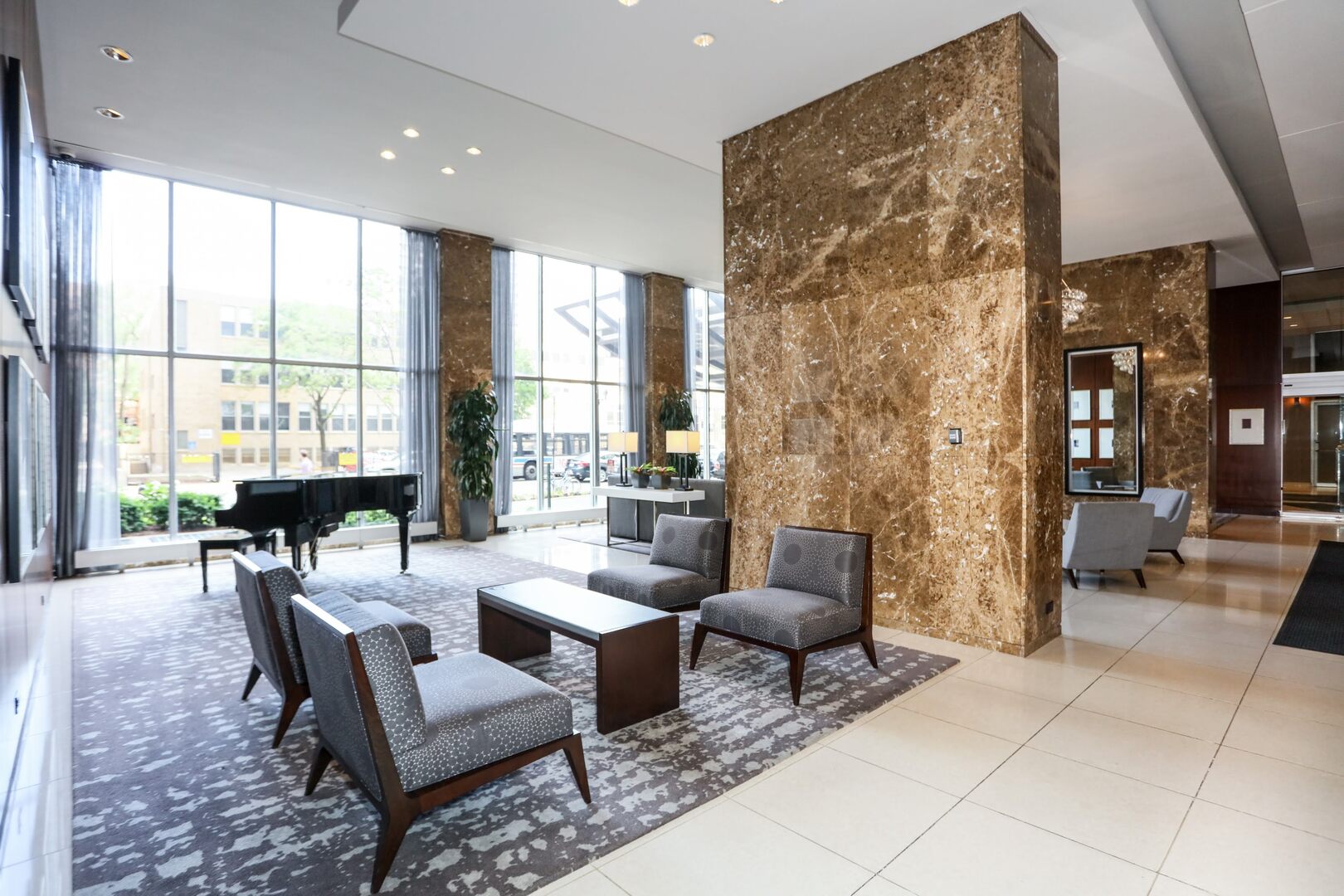 655 West Irving Park Road, Unit 1017 Chicago, IL 60613 - Photo 4 of 24 a living room with furniture and a large window