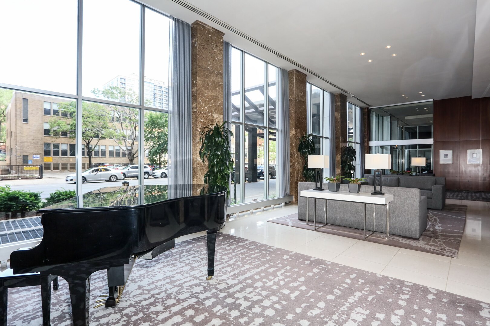 655 West Irving Park Road, Unit 1017 Chicago, IL 60613 - Photo 5 of 24 a living room with a large window and a table