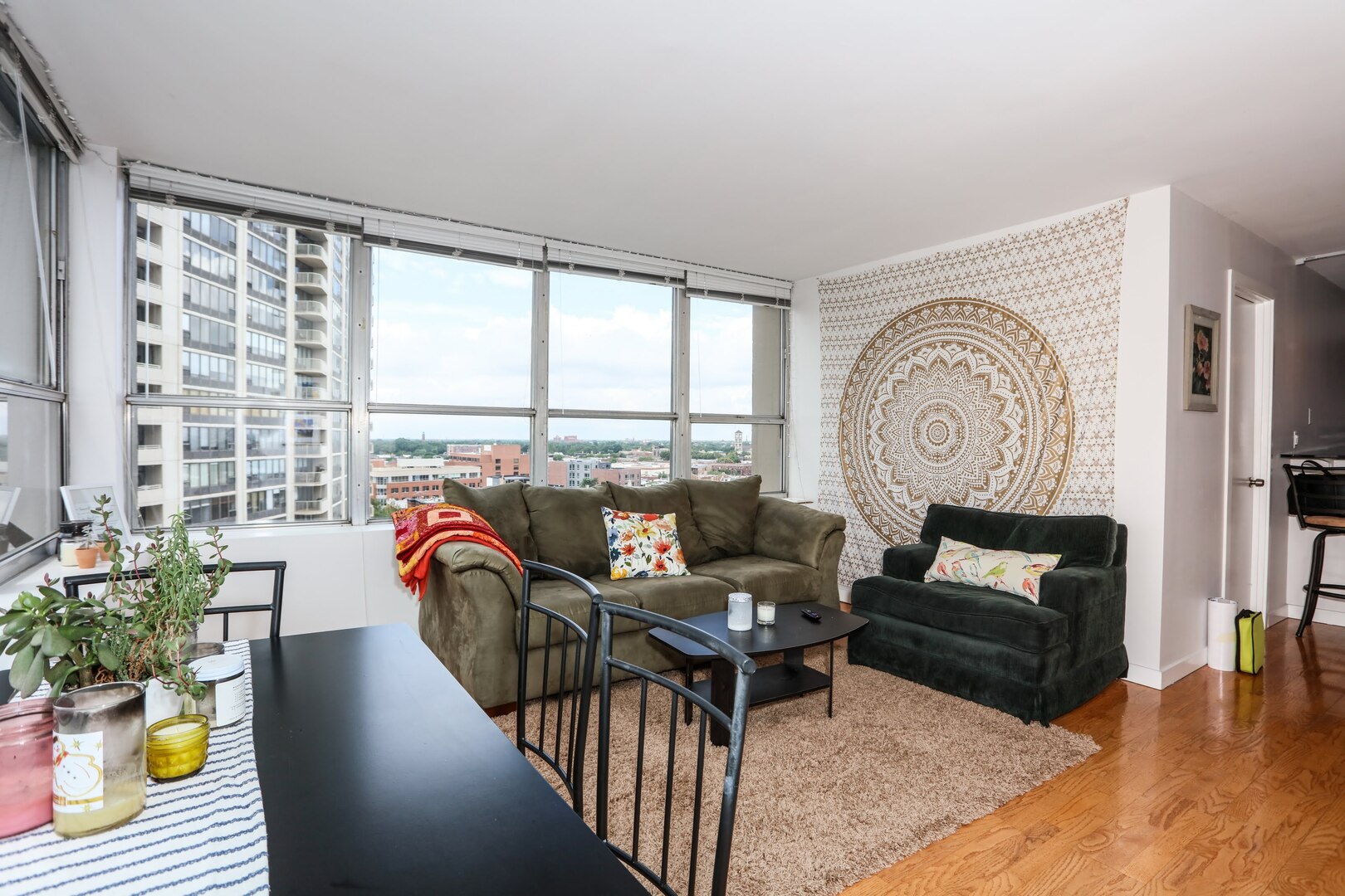 655 West Irving Park Road, Unit 1017 Chicago, IL 60613 - Photo 6 of 24 a living room with furniture and a large window