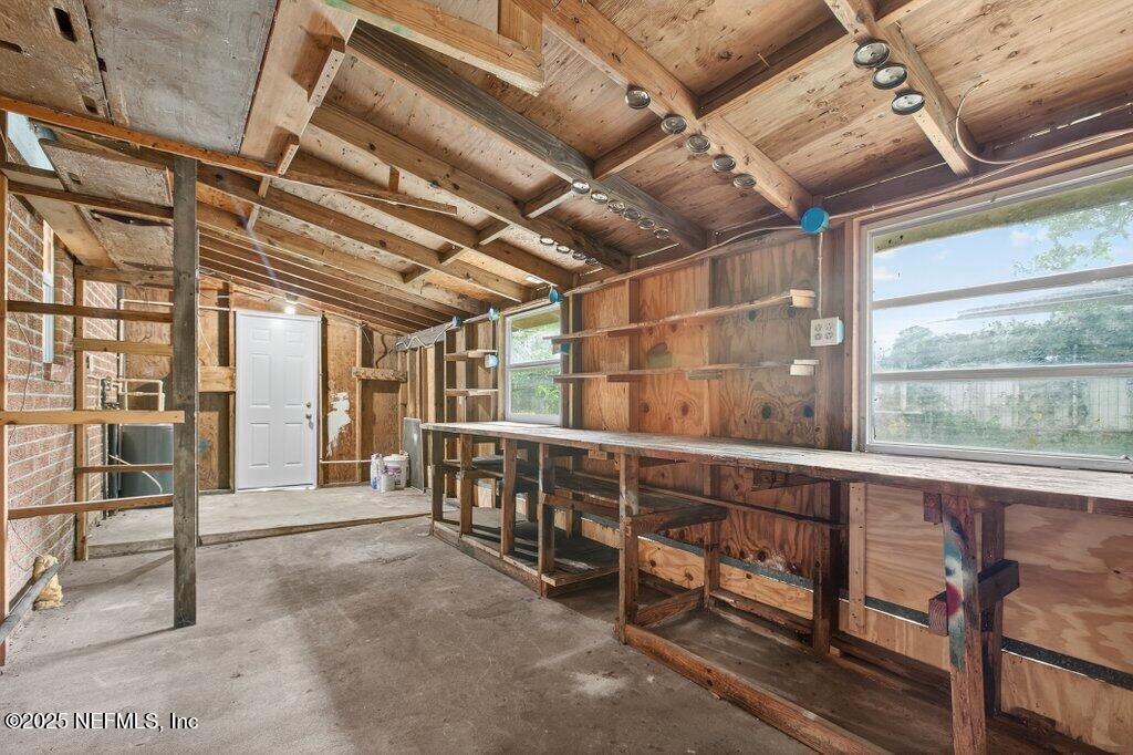 7326 Melvin Road Jacksonville, FL 32210 - Photo 31 of 42 a view of an empty room with wooden roof