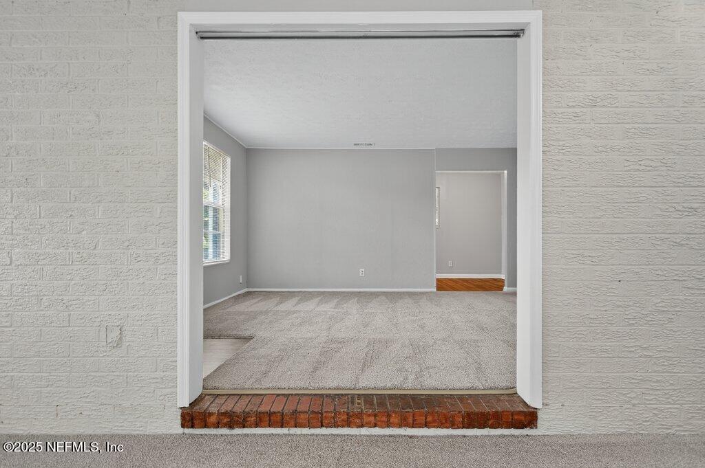 7326 Melvin Road Jacksonville, FL 32210 - Photo 8 of 42 a view of a room with an empty space