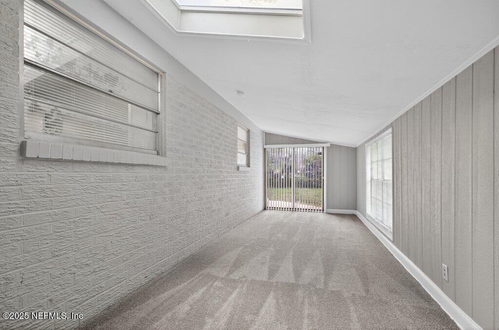 7326 Melvin Road Jacksonville, FL 32210 - Photo 9 of 42 a view of an empty room with a window