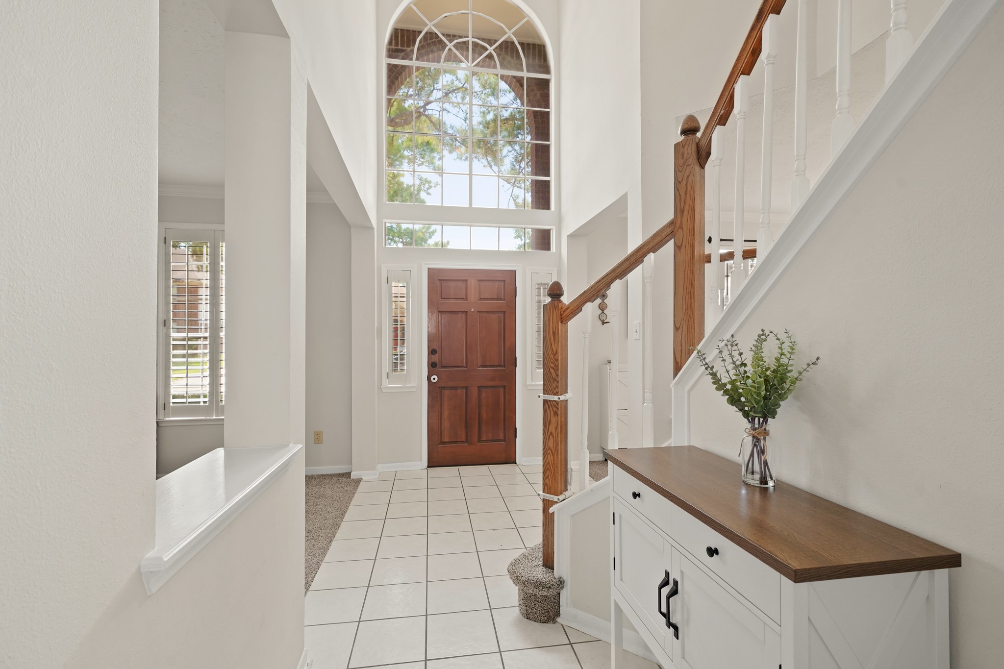 16114 Kintyre Point Road Houston, TX 77095 - Photo 11 of 39 The front hallway has tile floors and a large closet under the stairs.
