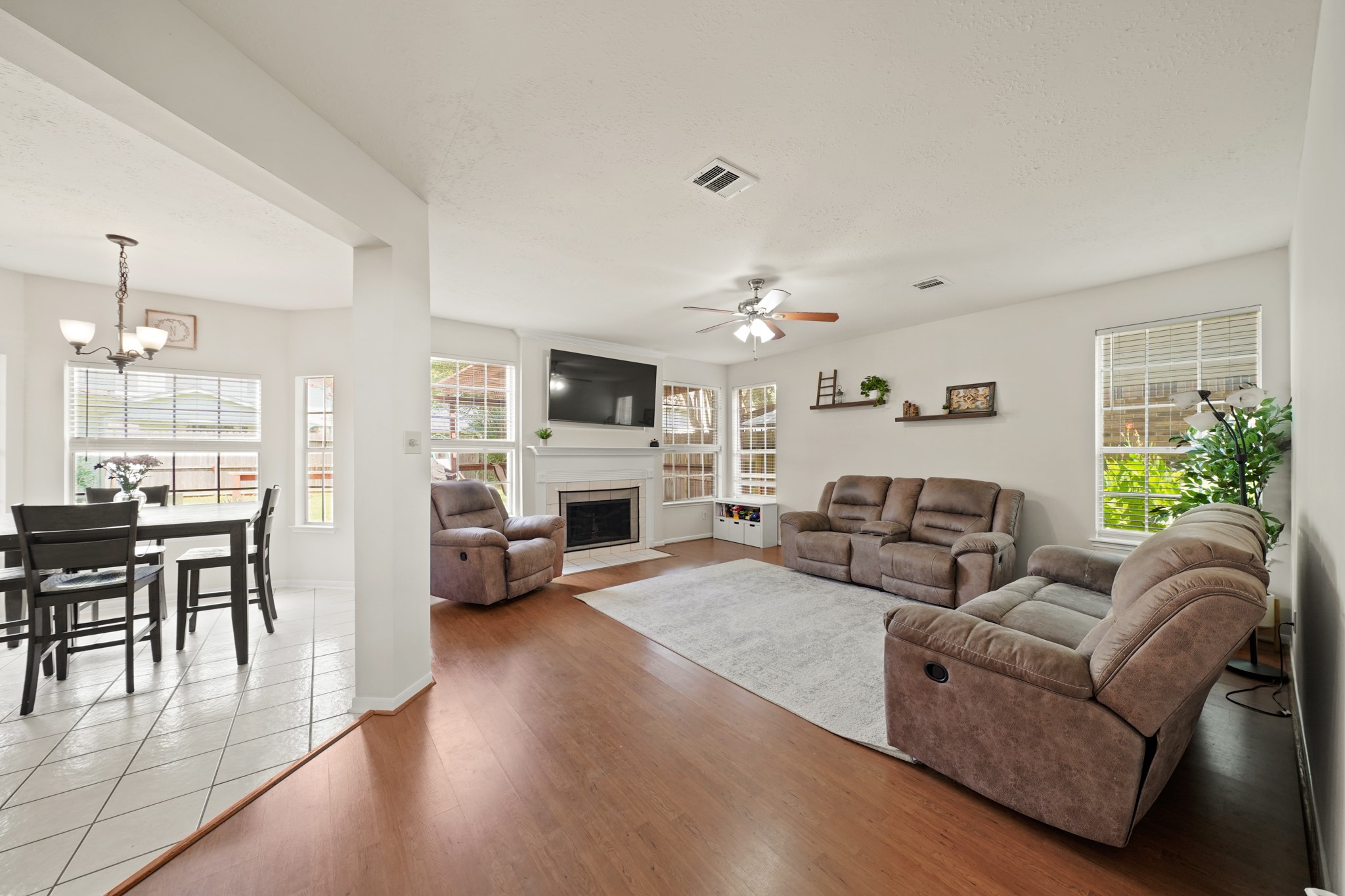 16114 Kintyre Point Road Houston, TX 77095 - Photo 36 of 39 The Family Room is flooded with natural light from large windows and the wonderful open concept floorplan makes every day living easy. The interior of the home was fully re-painted in 2024 and is light and fresh.