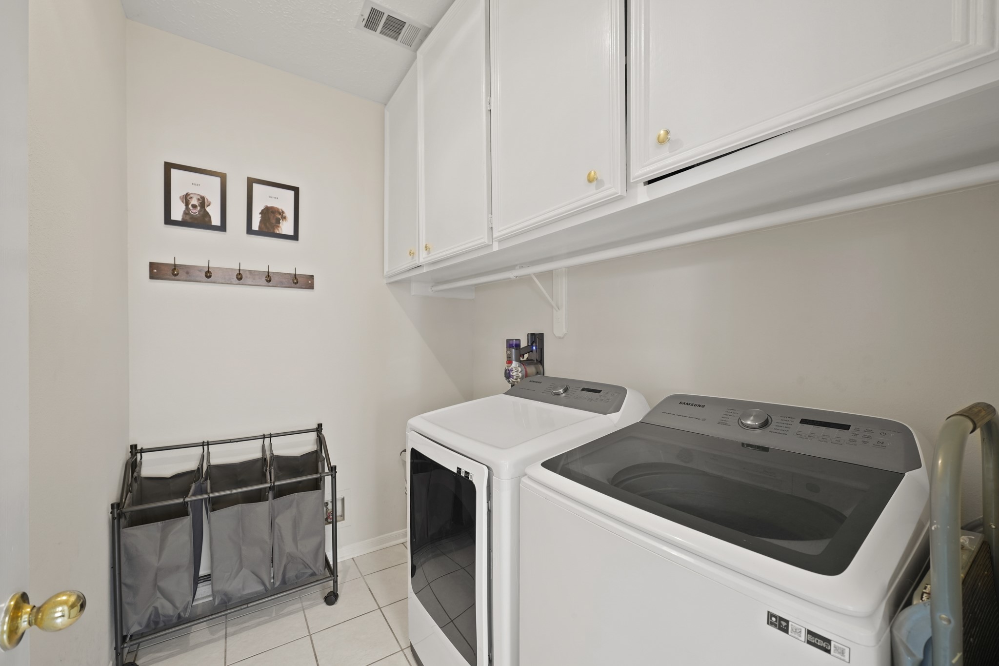 16114 Kintyre Point Road Houston, TX 77095 - Photo 19 of 39 The oversized laundry room offers plenty of extra cabinetry for storage.