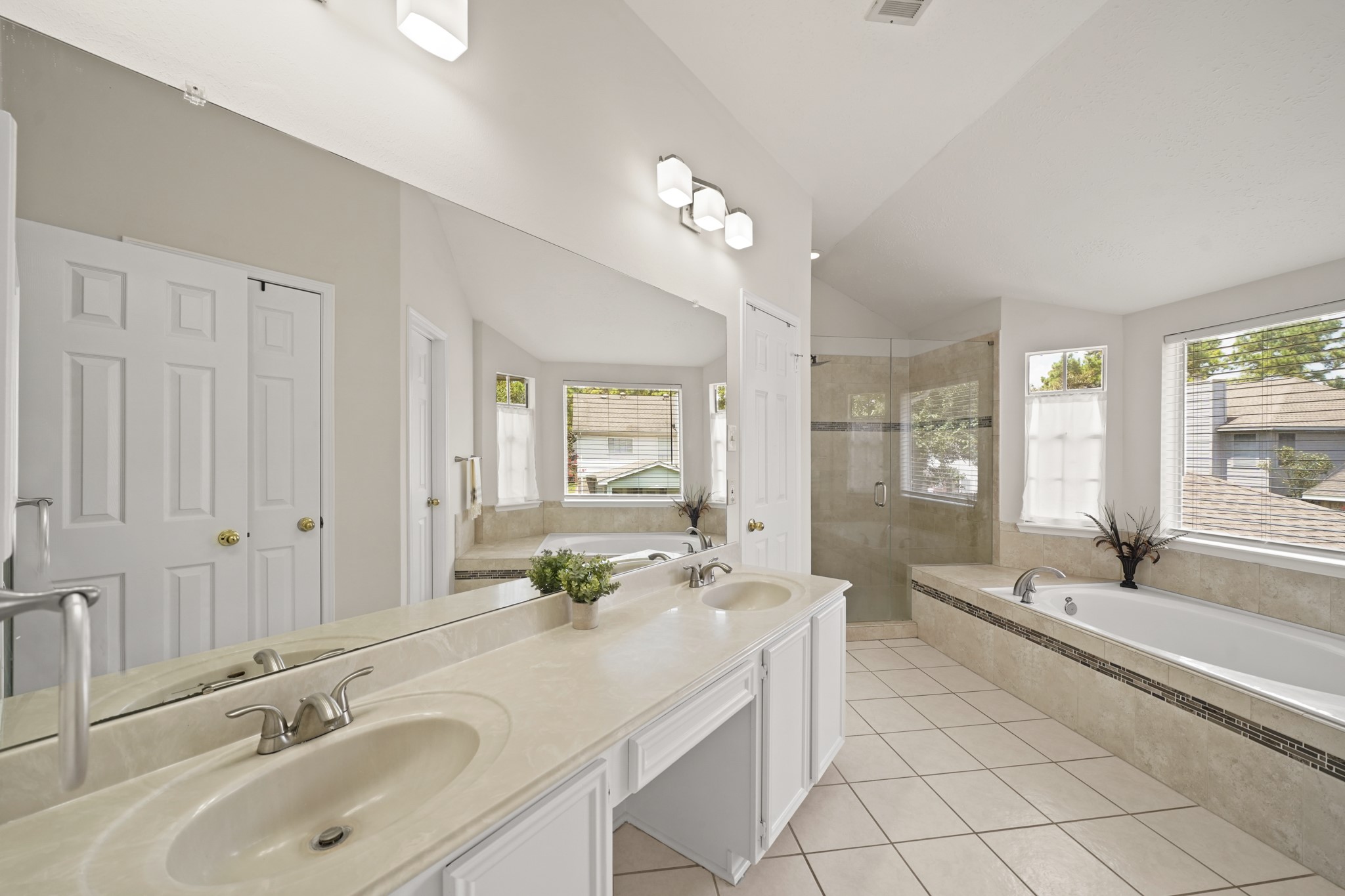 16114 Kintyre Point Road Houston, TX 77095 - Photo 23 of 39 The large ensuite primary bathroom is a dream with dual sinks, a large garden tub and oversized shower.
