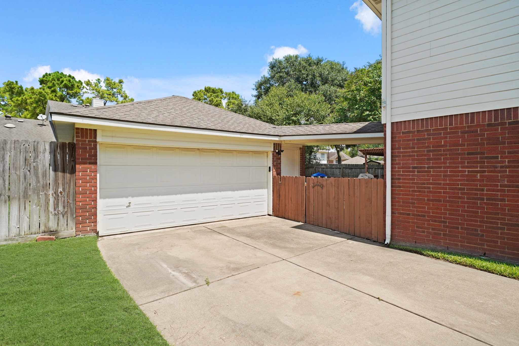 16114 Kintyre Point Road Houston, TX 77095 - Photo 4 of 39 A two car detached garage is found down the long driveway.