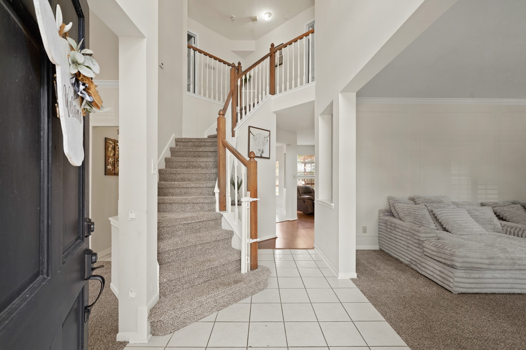 16114 Kintyre Point Road Houston, TX 77095 - Photo 6 of 39 Enter into the two story hallway with a large window bringing in natural light.