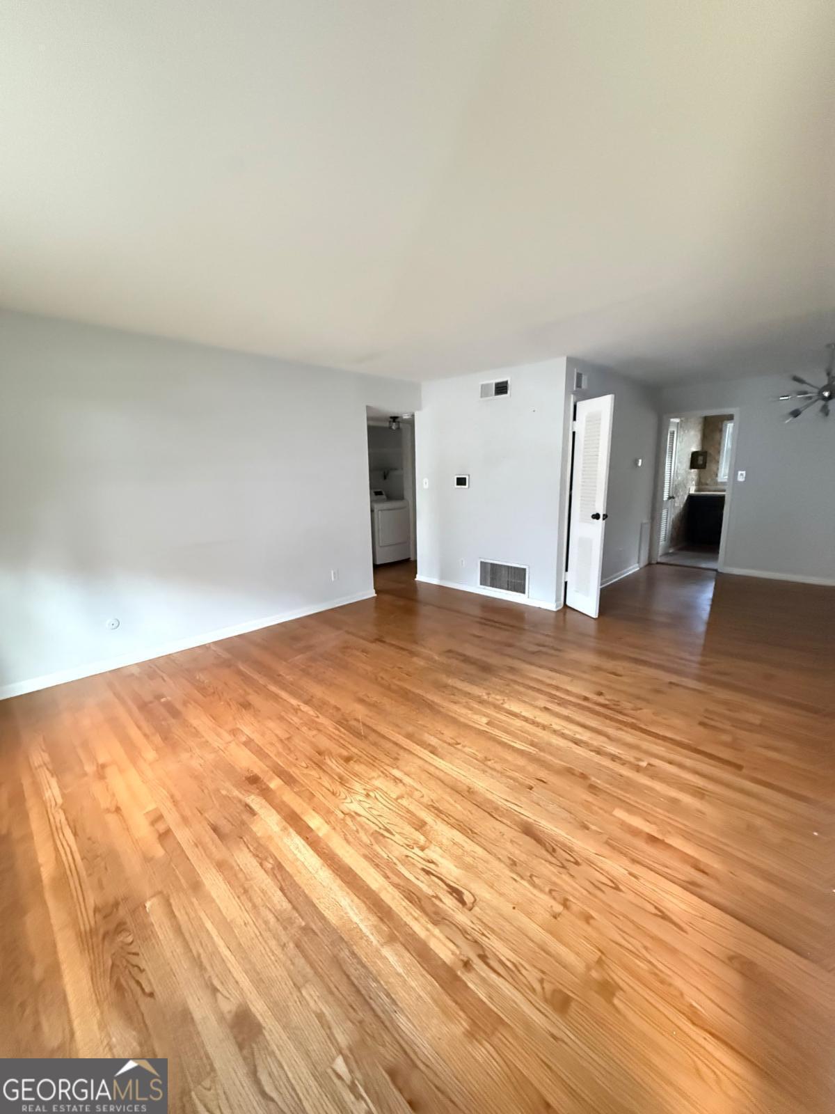 3510 Roswell Road, Unit H1 Atlanta, GA 30326 - Photo 30 of 43 a view of empty room with wooden floor