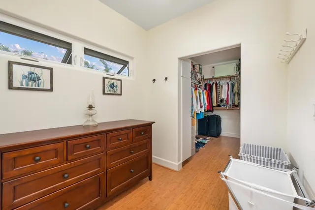 a living room with furniture and baby chair