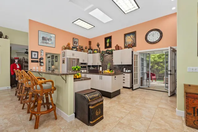 a living room with furniture and a clock