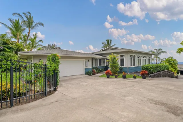 a view of a house with garden and plants