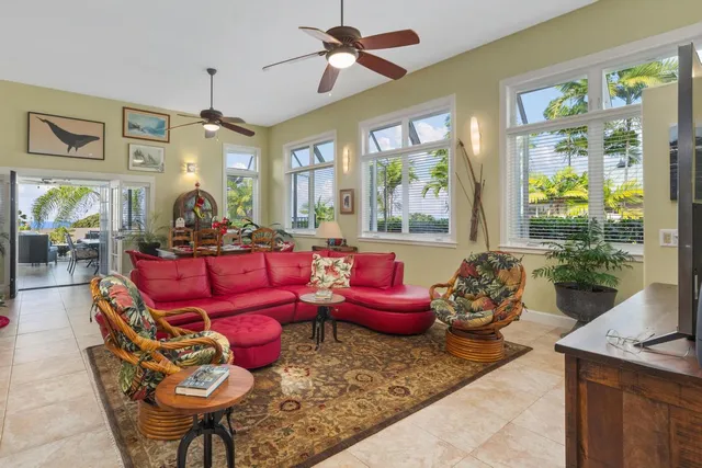 a living room with furniture toys and a large window