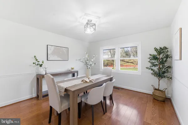 a kitchen with stainless steel appliances granite countertop a stove top oven a sink dishwasher a refrigerator and a microwave