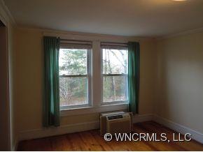 140 Hall Road Rutherfordton, NC 28139 - Photo 15 of 24 a view of an empty room with wooden floor and a window