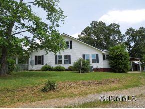 140 Hall Road Rutherfordton, NC 28139 - Photo 22 of 24 a view of a house with a yard