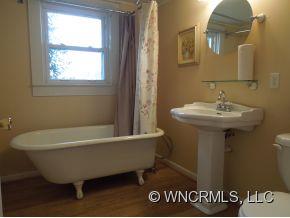 140 Hall Road Rutherfordton, NC 28139 - Photo 8 of 24 a bathroom with a sink and a bathtub