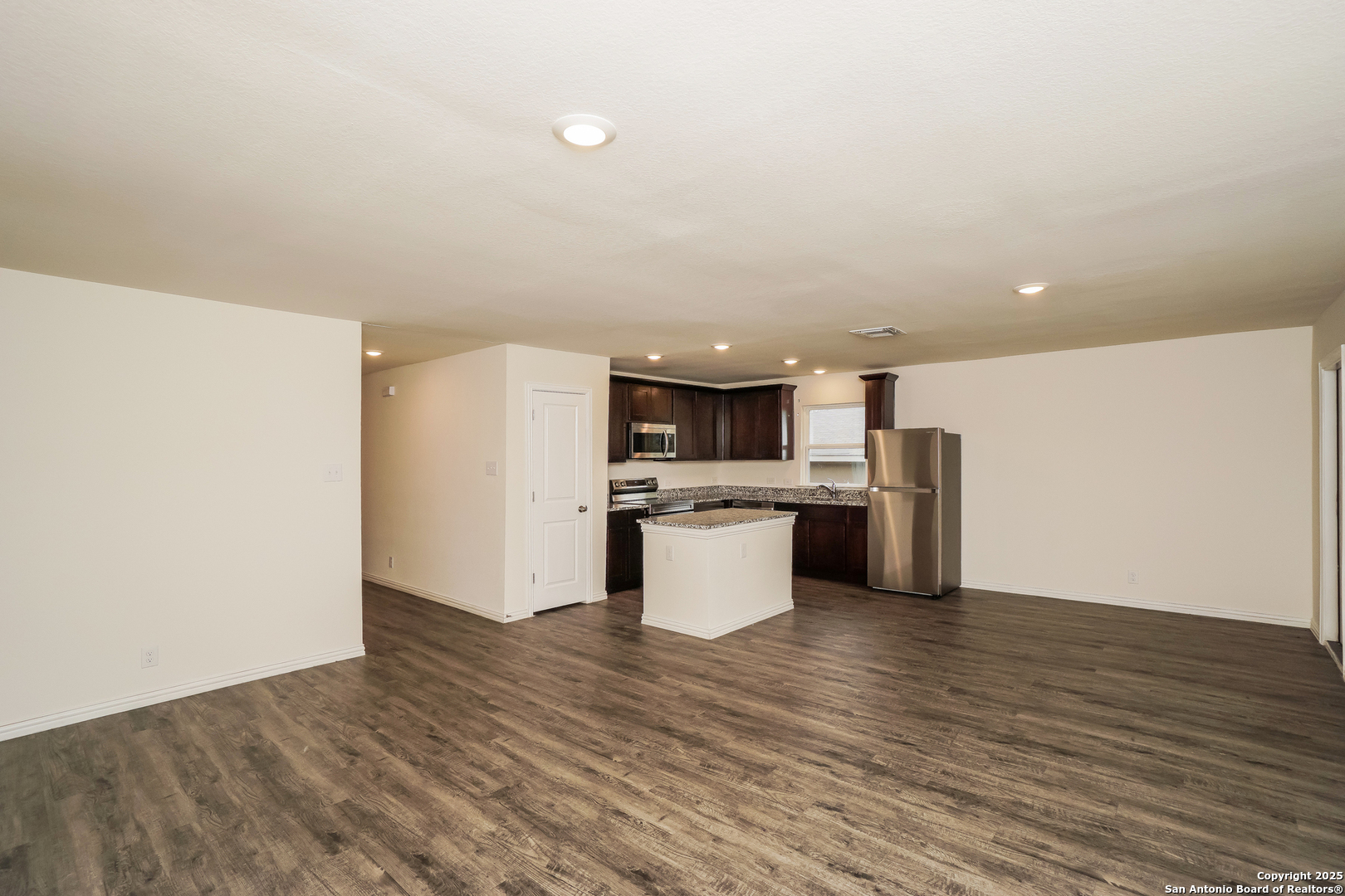 5334 Natho Street San Antonio, TX 78222 - Photo 5 of 21 a kitchen with a sink and white cabinets