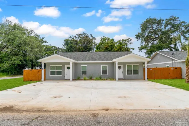 front view of a house with a yard