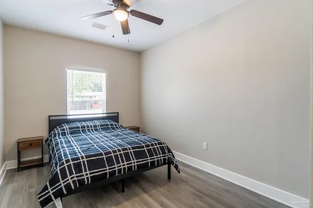 a bedroom with a bed and window