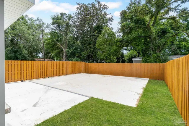 a view of backyard with small garden
