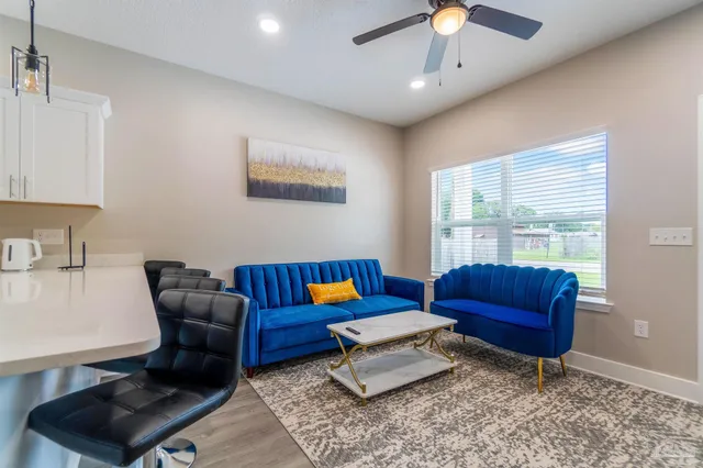 a living room with furniture and a window