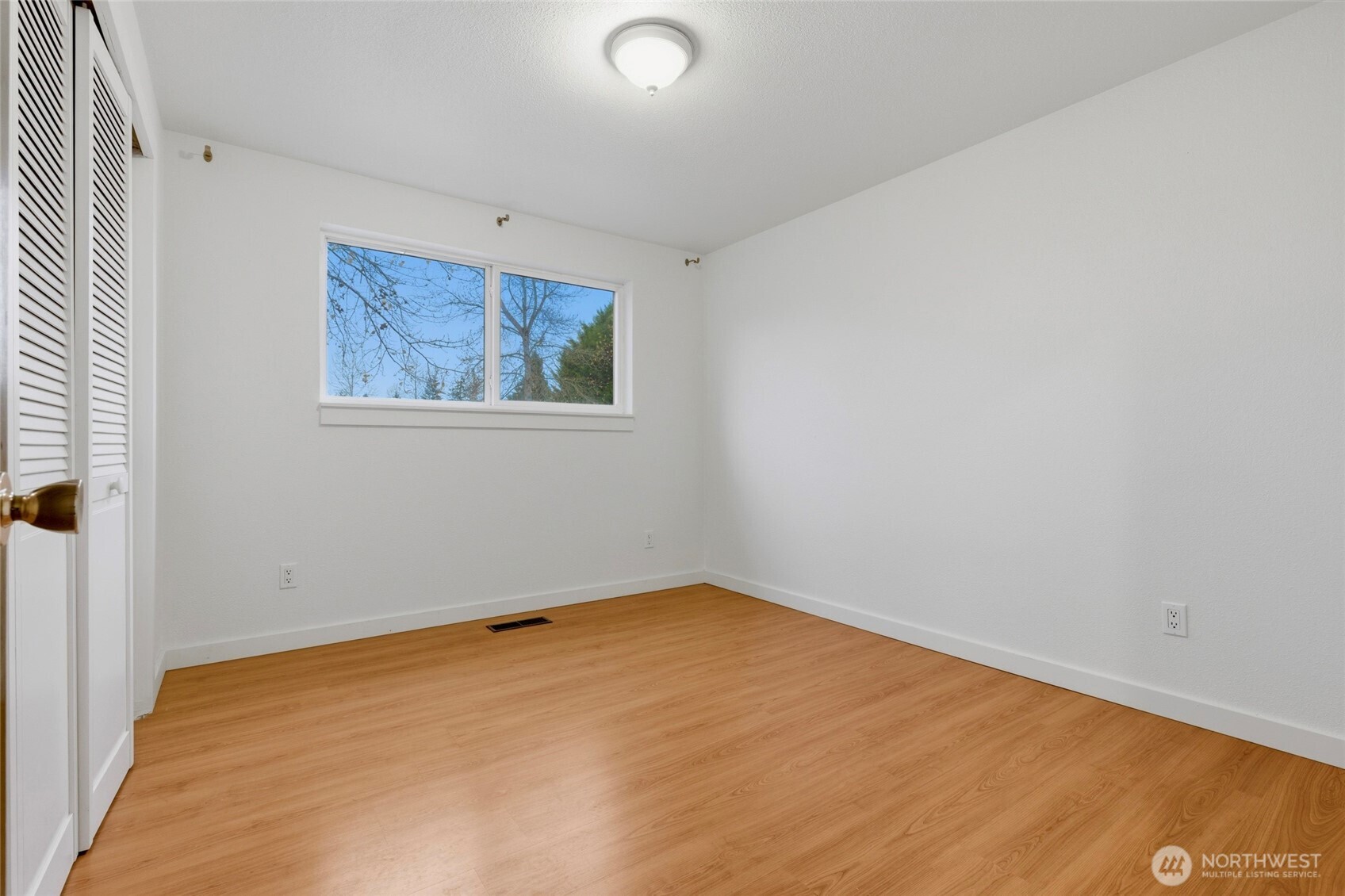 11906 Golden Given Road East Tacoma, WA 98445 - Photo 20 of 40 an empty room with a window
