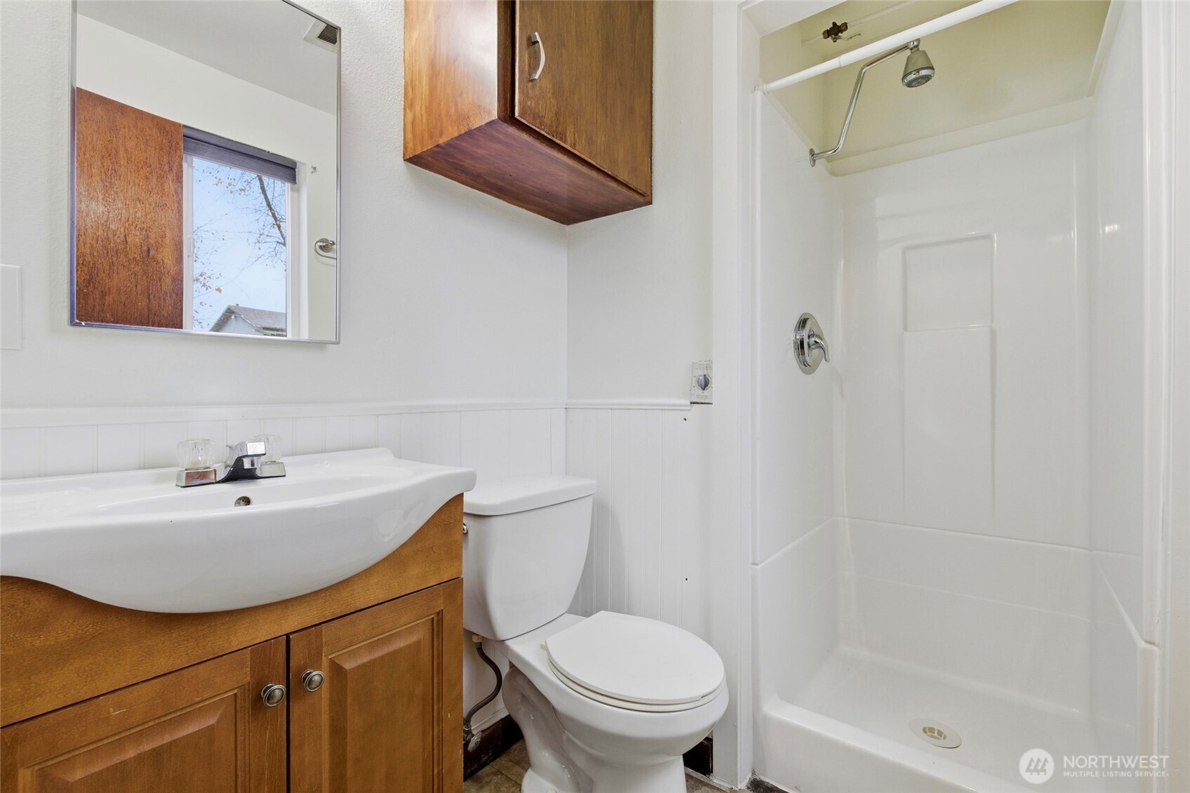 11906 Golden Given Road East Tacoma, WA 98445 - Photo 29 of 40 a bathroom with a sink a toilet and shower