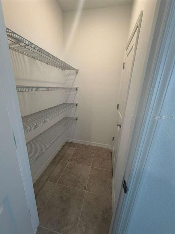 4617 Orchard View Alley Winter Garden, FL 34787 - Photo 13 of 32 a view of storage and utility room