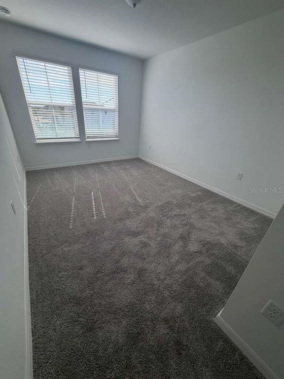 4617 Orchard View Alley Winter Garden, FL 34787 - Photo 20 of 32 an empty room with windows