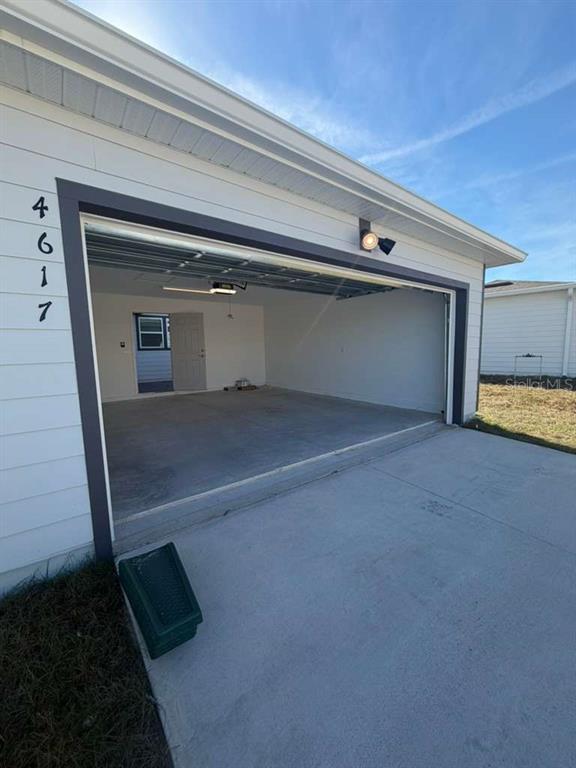 4617 Orchard View Alley Winter Garden, FL 34787 - Photo 29 of 32 a view of a garage