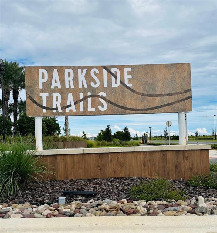 4617 Orchard View Alley Winter Garden, FL 34787 - Photo 30 of 32 a street sign on a wall next to a road