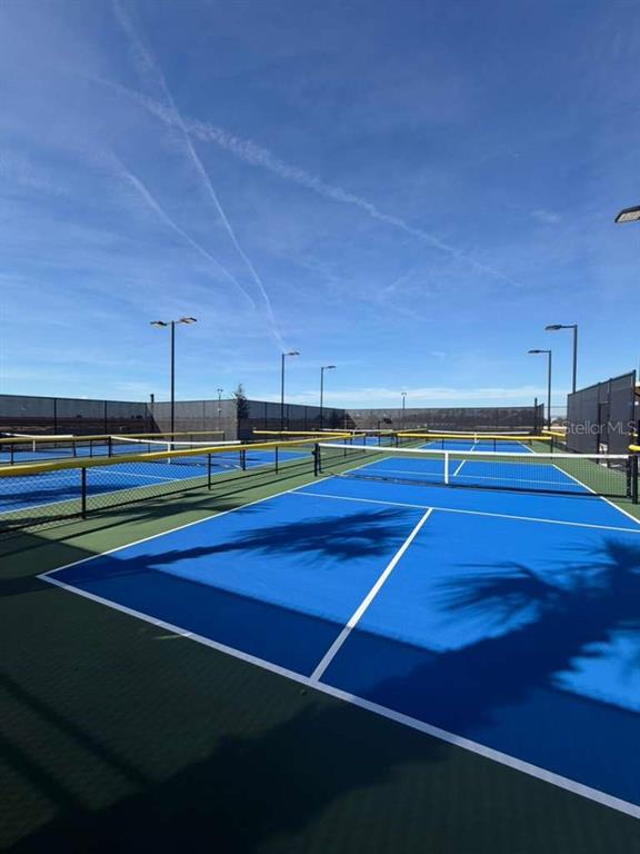 4617 Orchard View Alley Winter Garden, FL 34787 - Photo 31 of 32 a view of an outdoor space and tennis court