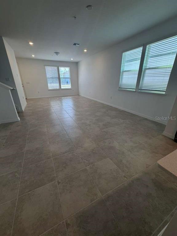 4617 Orchard View Alley Winter Garden, FL 34787 - Photo 6 of 32 an empty room with windows