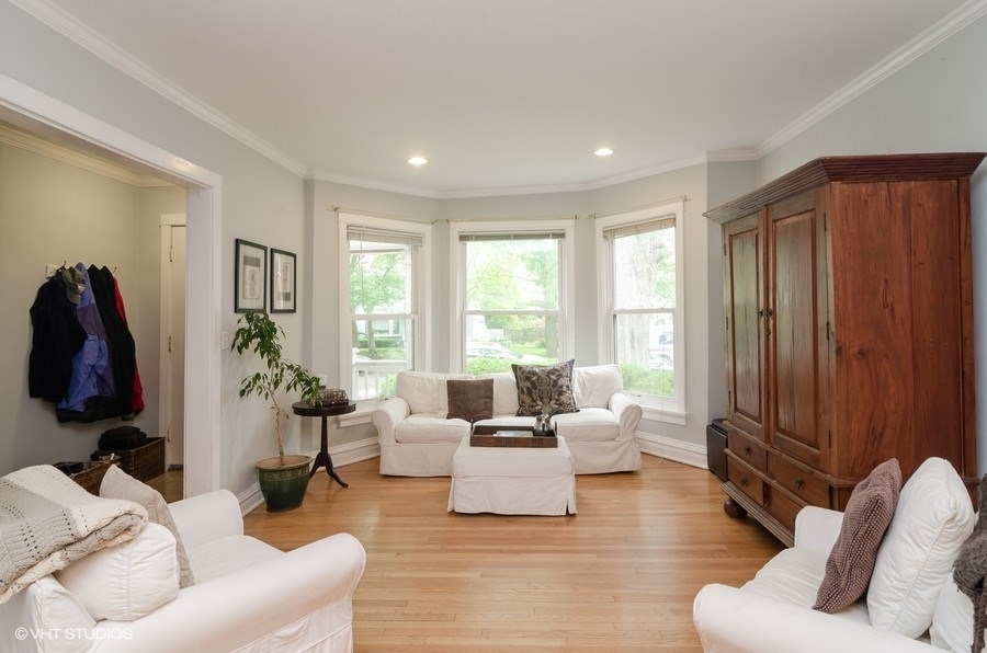 2022 Colfax Street, Unit 1 Evanston, IL 60201 - Photo 2 of 10 a living room with furniture window and a flat screen tv