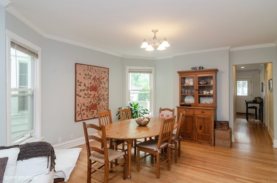 2022 Colfax Street, Unit 1 Evanston, IL 60201 - Photo 3 of 10 a view of a dining room with furniture and wooden floor