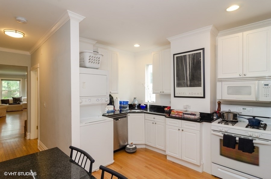 2022 Colfax Street, Unit 1 Evanston, IL 60201 - Photo 6 of 10 a kitchen with a sink stove and cabinets