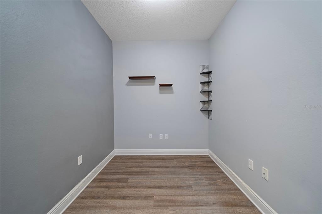 558 Harbor Ridge Drive Palm Harbor, FL 34683 - Photo 10 of 27 a view of room with stairs and wooden floor