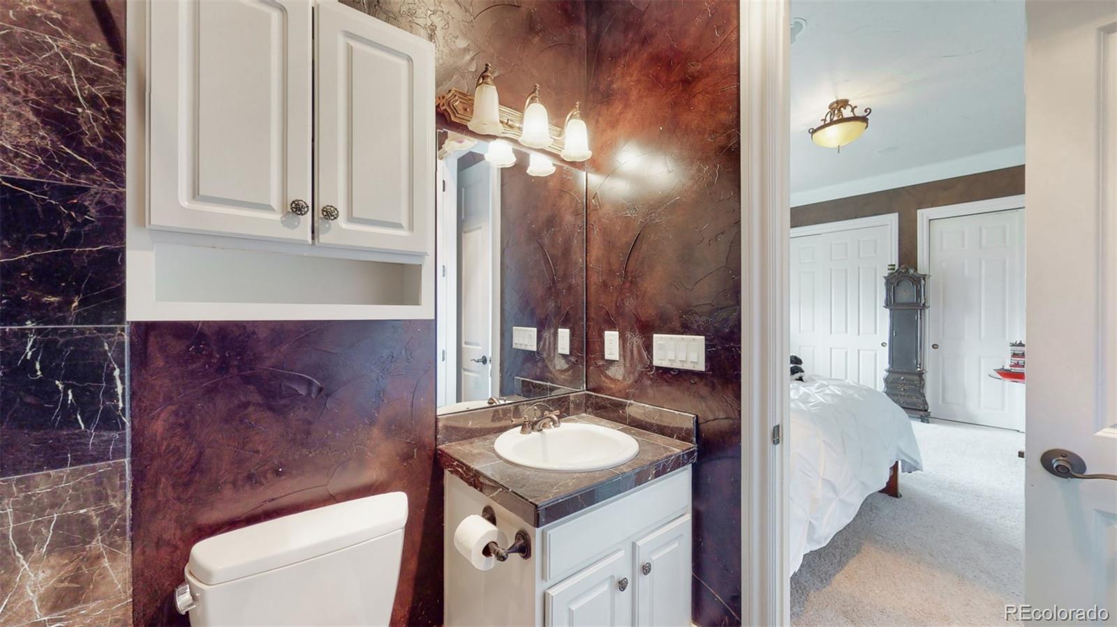 2775 E Highway Monument, CO 80132 - Photo 17 of 40 a bathroom with a sink a toilet and shower