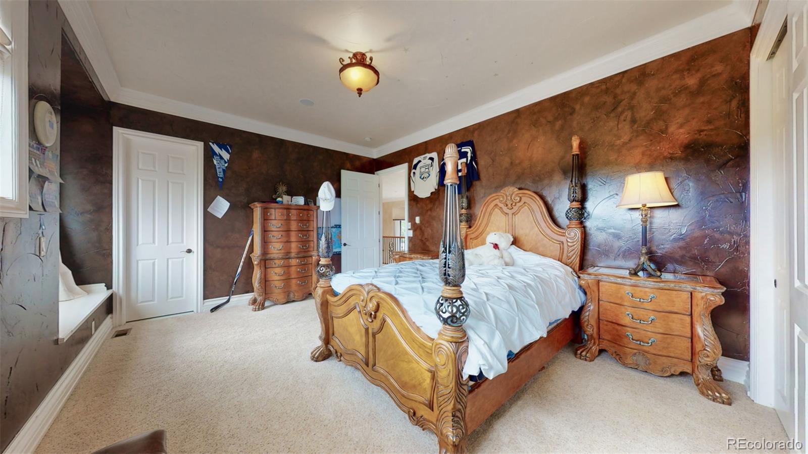 2775 E Highway Monument, CO 80132 - Photo 18 of 40 a bed room with a bed and a lamp