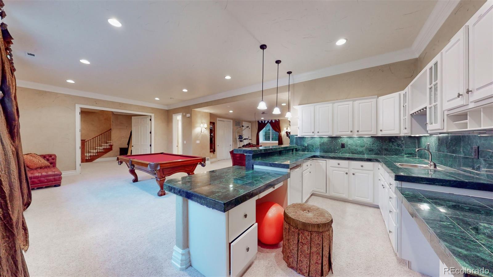 2775 E Highway Monument, CO 80132 - Photo 24 of 40 a kitchen with a sink a stove and cabinets