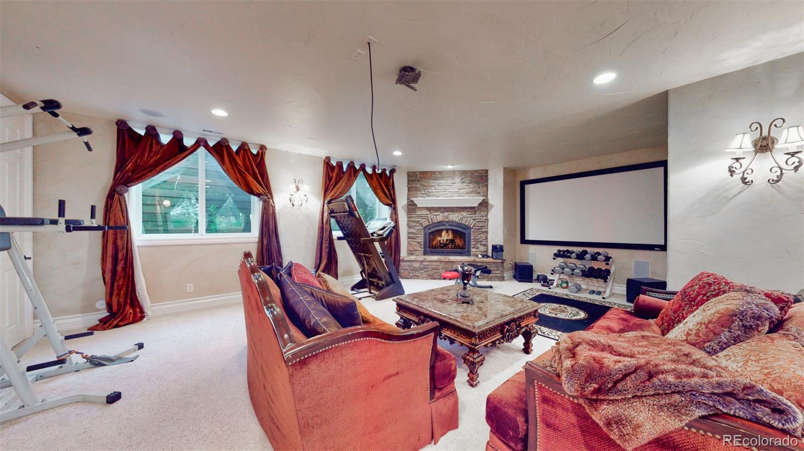 2775 E Highway Monument, CO 80132 - Photo 25 of 40 a living room with furniture a flat screen tv and a window