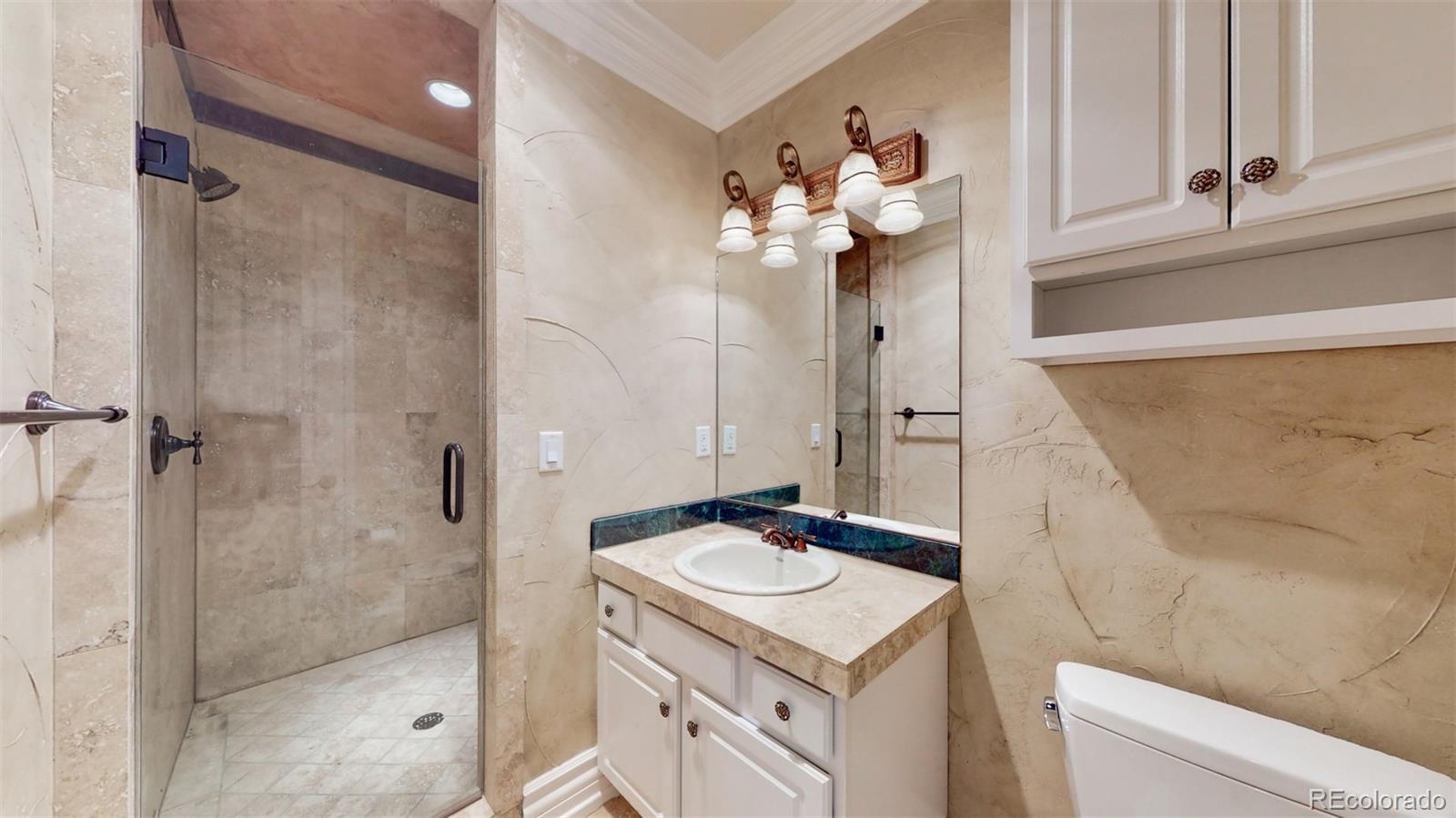 2775 E Highway Monument, CO 80132 - Photo 27 of 40 a bathroom with a sink mirror and shower