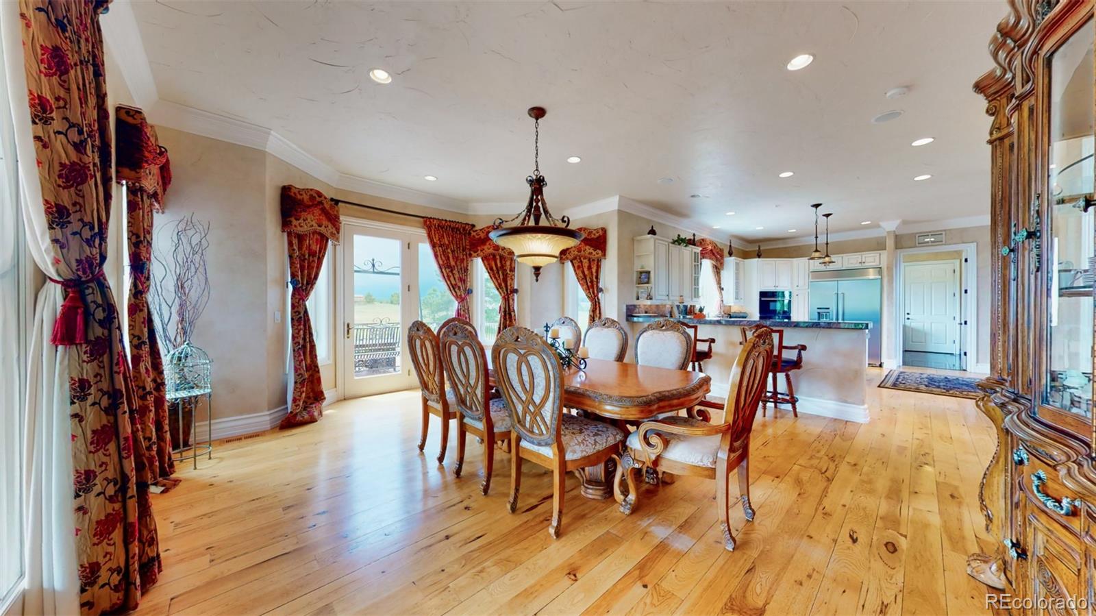 2775 E Highway Monument, CO 80132 - Photo 7 of 40 a dining room with furniture entryway and wooden floor