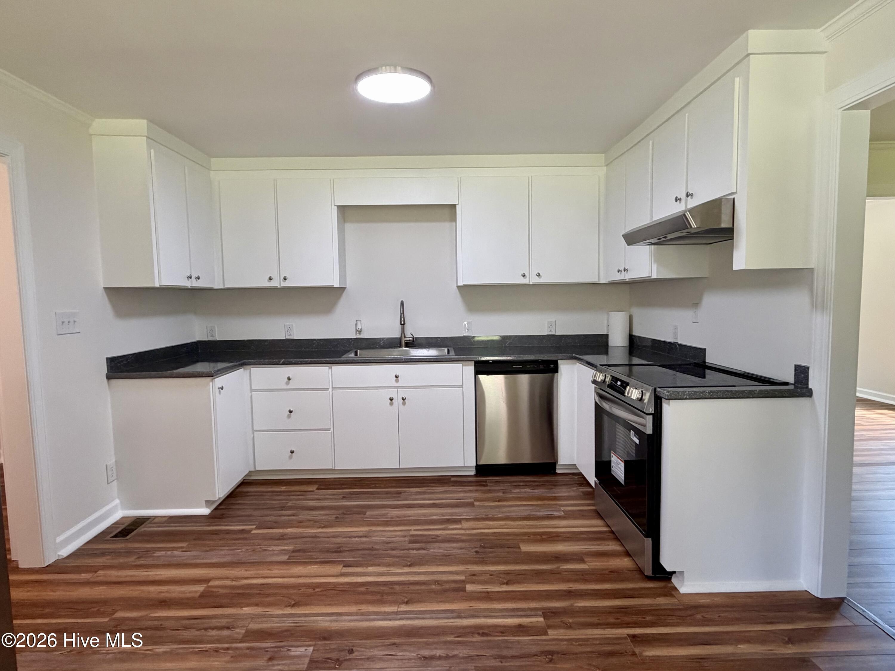 2443 Creekside Road Kinston, NC 28504 - Photo 11 of 60 This spacious kitchen offers new cabinets, countertops, and new appliances.